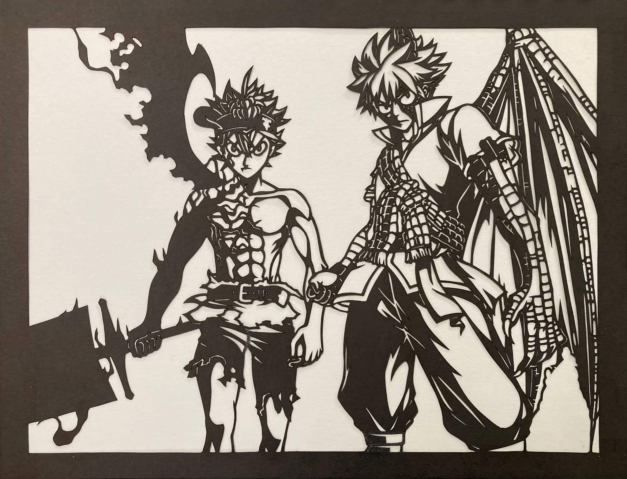 A black and white paper cutting of Asta in his demon form and Natsu in his dragon force form