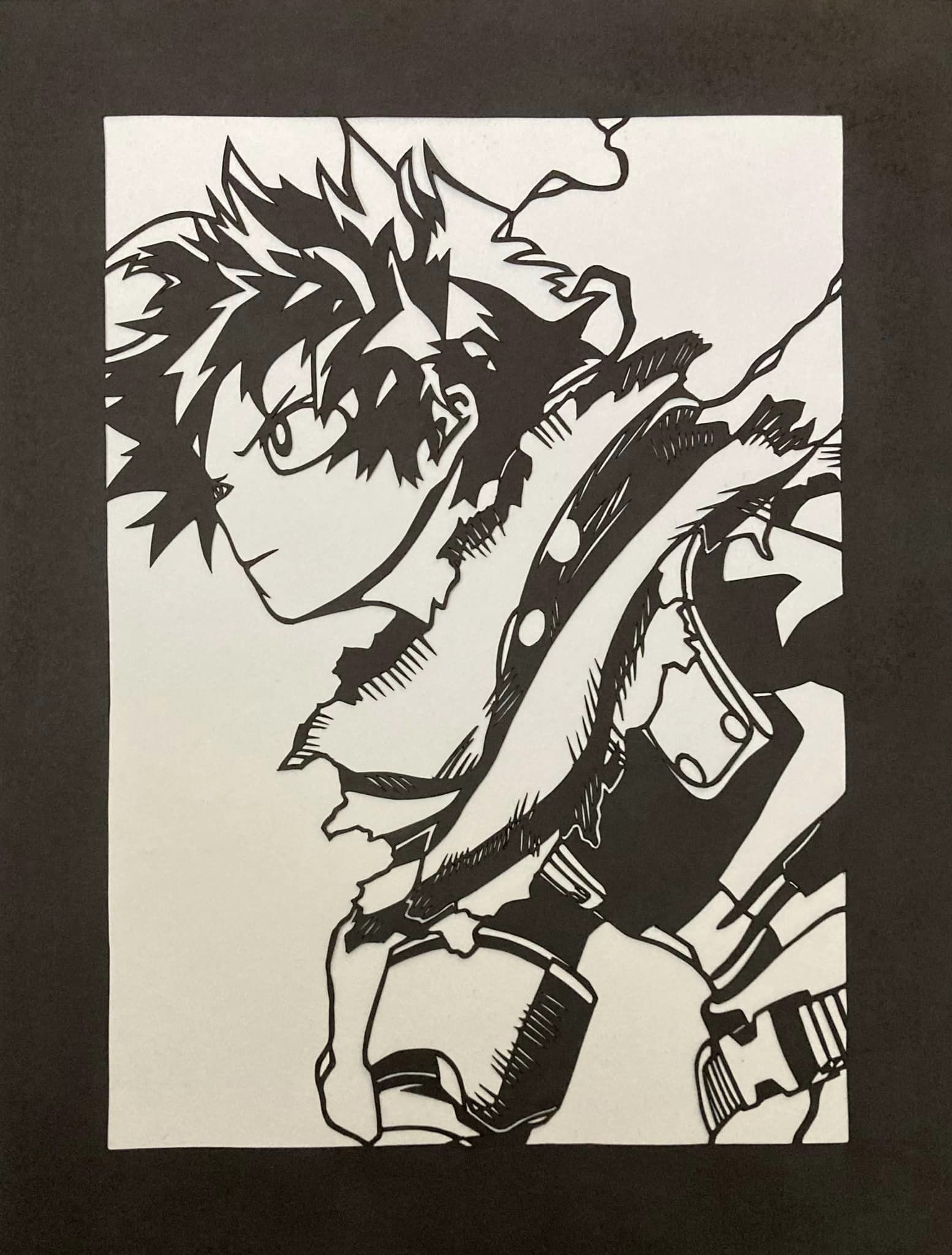 A black and white paper cutting of Deku in his hero costume zeta version